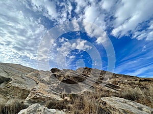 Blue skies and dramatic clouds over the lunar landscapes of Paros, Greece — EUROPE